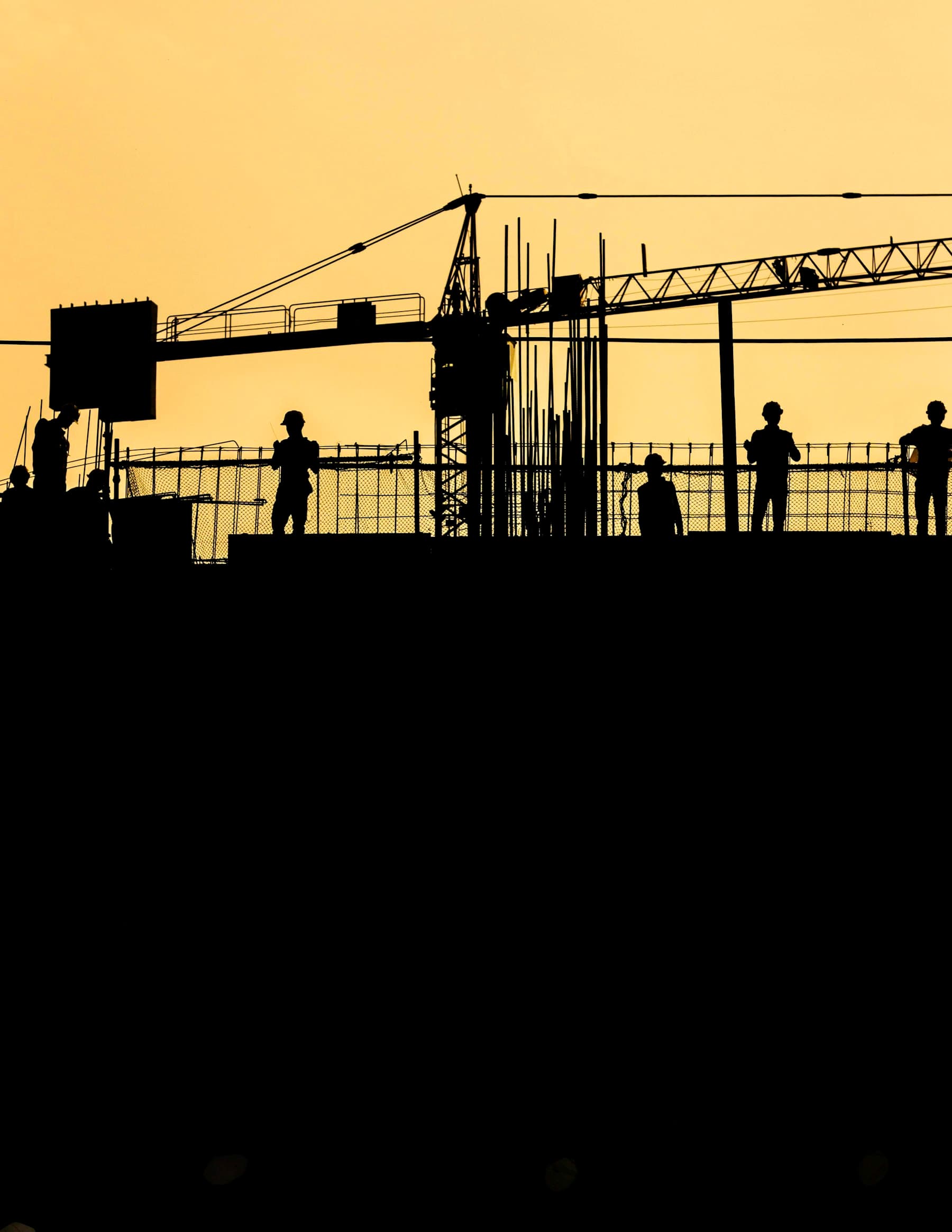 Crew silhouetted at sunset